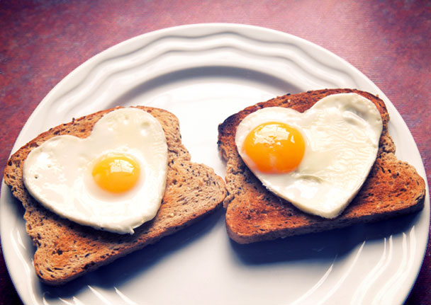Heart-shaped hard boiled eggs on toast