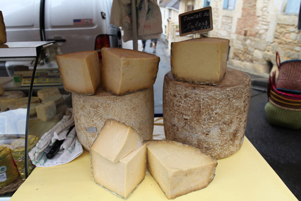 <strong>Cheese</strong><br> For Americans, <em>fromage</em> really is one of the main draws of France's farmers' markets. It's a rare treat to sample unpasteurized ones since the Feds ban importing any raw cheese aged less than two months. This wheel of raw cow's-milk cheese from Salers in Cantal might make it through customs, as it's aged at least three months to create a hard wedge. Farmers craft it during the summer months, from milk produced by cows grazing on high-mountain grass in Auvergne, about 100 miles from the Le Bugue market.