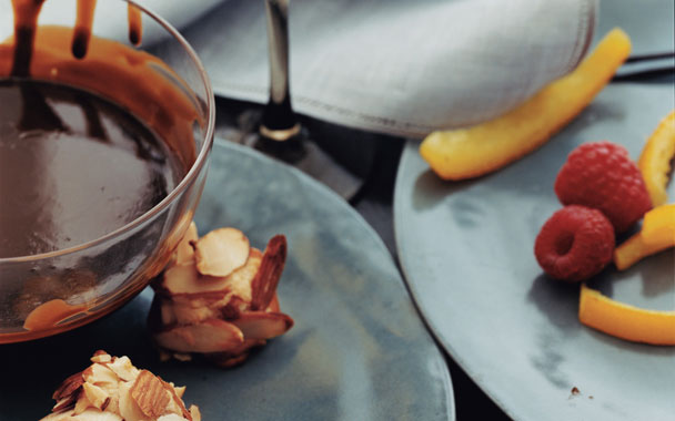 Chocolate Fondue with Candied Orange Peel, Raspberries, and Almond Macaroons