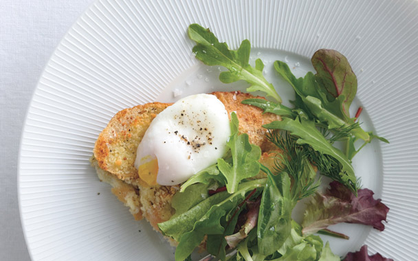 savory parmesan pain perdu with poached eggs and greens
